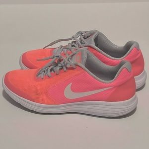 Pink and Orange Nike revolution 3